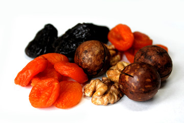 dried fruits and nuts on white background