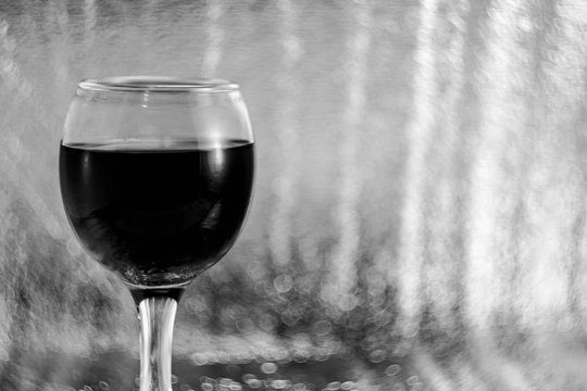  A glass of wine. Black and white image