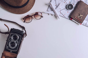 Retro camera with travel accessories and items on white background with copy space, Travel concept