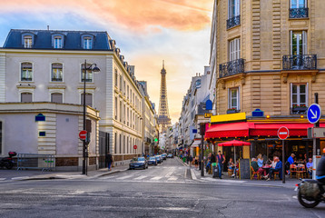 Cozy street with tables of cafe in Paris, France. Architecture and landmark of Paris. Cozy Paris cityscape. - obrazy, fototapety, plakaty