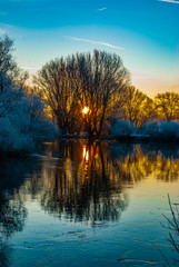 A river in the early winter morning during colorful sunrise