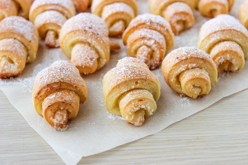 Cheese bagels with powdered sugar.