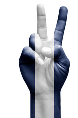 and making victory sign, Nicaragua painted with flag as symbol of victory, win, success - isolated on white background