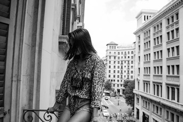 woman posing in a balcony