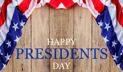 Fototapeta na wymiar Happy Presidents' Day text on wooden with flag of the United States Border