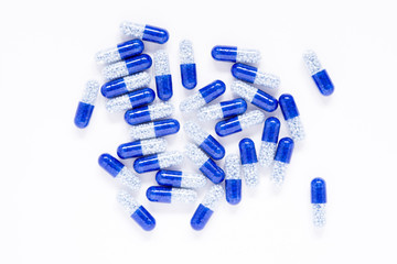 blue capsules on a white background