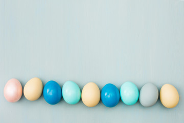 easter eggs on blue wooden background