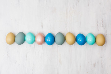 easter eggs on white wooden background