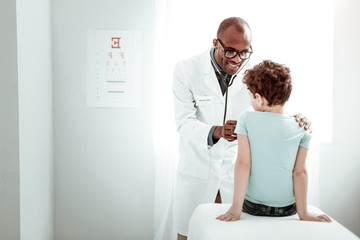Handsome young practitioner doing monthly health checkup