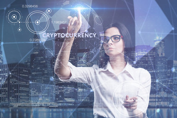 The concept of business, technology, the Internet and the network. A young entrepreneur working on a virtual screen of the future and sees the inscription: Cryptocurrency