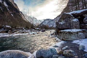 river in the mountains in Murren, Switzerland during winter 