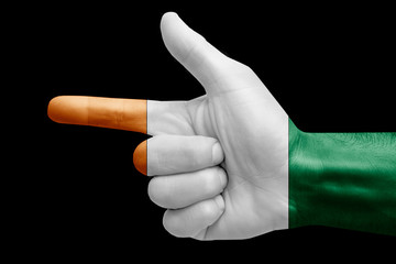 hand symbol with a sign of a gun, painted with the flag of cote d'ivoire