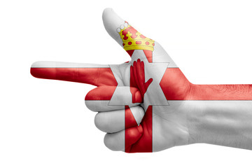 hand symbol with a sign of a gun, painted with the flag of northern ireland