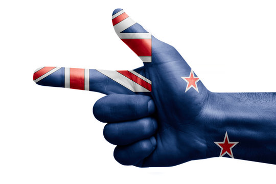 hand symbol with a sign of a gun, painted with the flag of new zealand