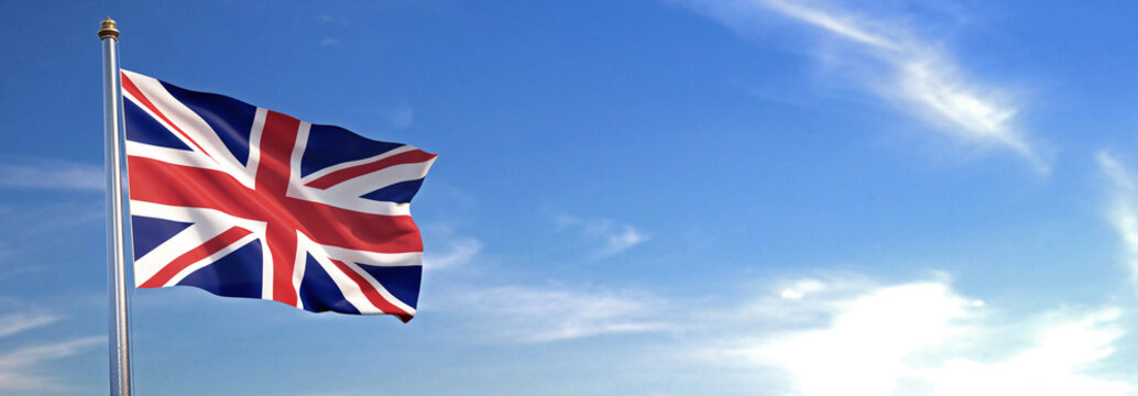 Flag Of UK Rise Waving To The Wind With Sky In The Background