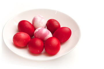 happy easter colored eggs with food dyes in the color of spring 2019 pink peacock and jester red