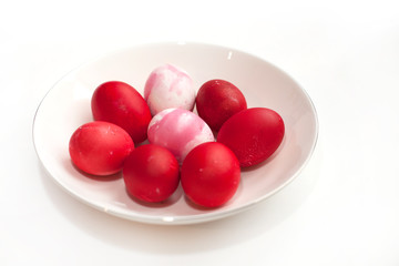 happy easter colored eggs with food dyes in the color of spring 2019 pink peacock and jester red