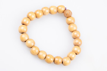 wood bracelet in wooden beads on white background