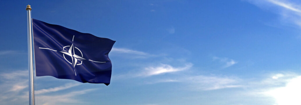 Flag of ONU rise waving to the wind with sky in the background