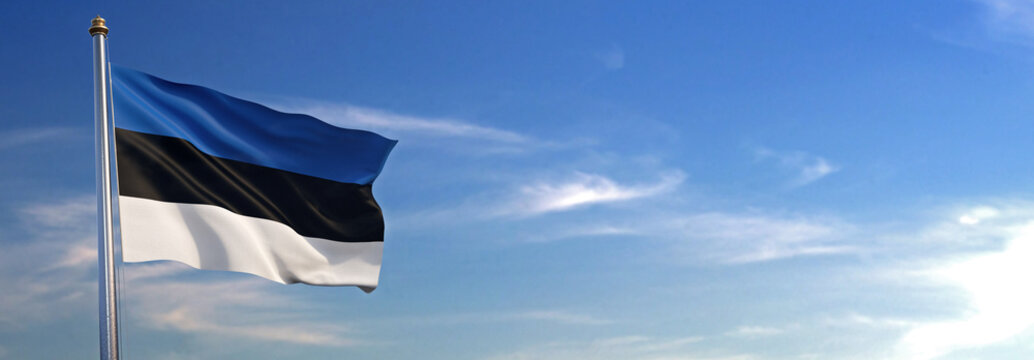 Flag of Estonia rise waving to the wind with sky in the background