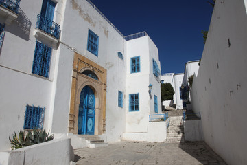 Fototapeta na wymiar Sidi Bou Said - typical building with white walls, blue doors and windows