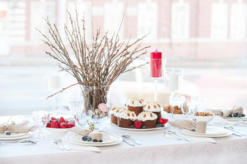 Simple festive Easter table setting with napkin Easter Bunny and pussy willow