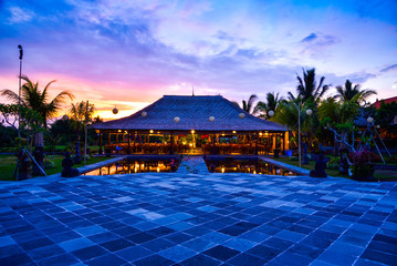 Sunset of traditional house resting resort area with pond, terrace rice field and green tree for family holiday and wedding couple honeymoon