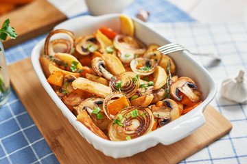 vegetarian roast without meat with pumpkin, potatoes and mushrooms; pumpkin dish