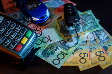 Australian dollar banknotes with terminal and toy car