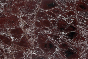 Closeup burgundy marble with natural pattern texture background.