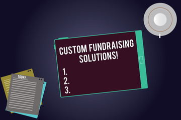 Writing note showing Custom Fundraising Solutions. Business photo showcasing software to help raising money online Tablet Screen Cup Saucer and Filler Sheets on Color Background