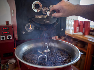 roasting and mixing roasted coffee in a roaster