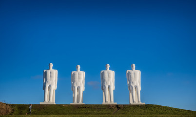 Men at sea colossal statues at the wadden sea in Esbjerg, Denmark