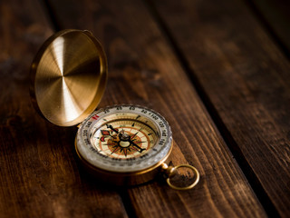 Compass on the wooden table
