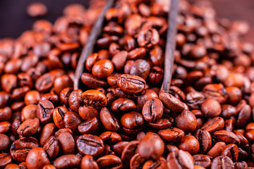 Seeds of fragrant coffee on a dark concrete background. It can be used as a background