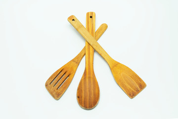 kitchen wooden spoon, paddles for mixing and cooking on a white background, three tools
