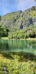 Mountain chalets in the woods near beautiful lake