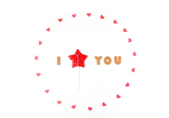 Valentine's day concept. Declaration of love, frame made of paper hearts, lollipop in form star. Flat lay, top view, white background, isolated, copy space