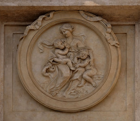 Charity Medallion on the Palazzo Montecitorio, seat of the Italian Chamber of Deputies in Rome, Italy 