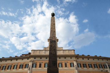 Fototapeta premium Palazzo Montecitorio, seat of the Italian Chamber of Deputies with the obelisk of Augustus in Rome, Italy