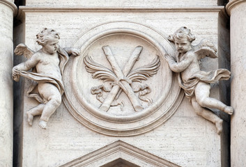Angels with symbols of martyrdom on the portal of Sant Andrea della Valle Church in Rome, Italy 