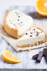 cheesecake with lemon orange and chocolate on white background