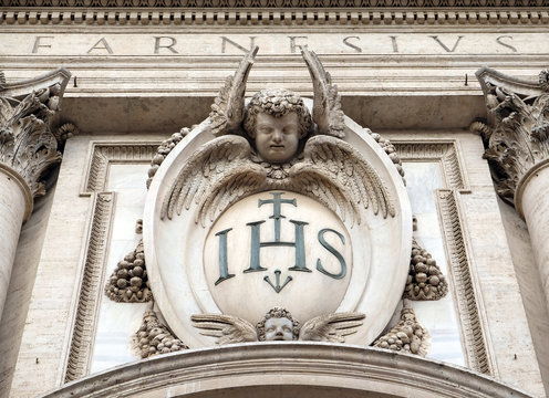 Christogram IHS, facade of the Church of the Gesu, mother church of the Society of Jesus, Rome, Italy 
