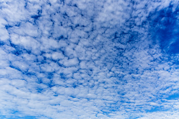 blue sky background with tiny clouds