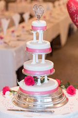 4 tier wedding cake with ribbon decoration