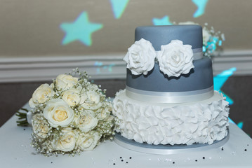 Wedding cake with white rose icing decoration