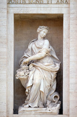 Fototapeta premium The statue of Abundance of the Trevi Fountain in Rome. Fontana di Trevi is one of the most famous landmark in Rome, Italy 