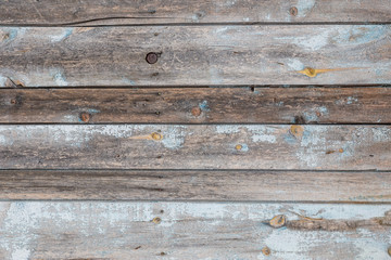 Obraz premium Old wooden planks with cracked blue paint