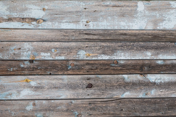 Obraz premium Old wooden planks with cracked blue paint