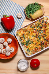 Chicken vegetable cheese glazed pie on the light wooden background. Home made receipt